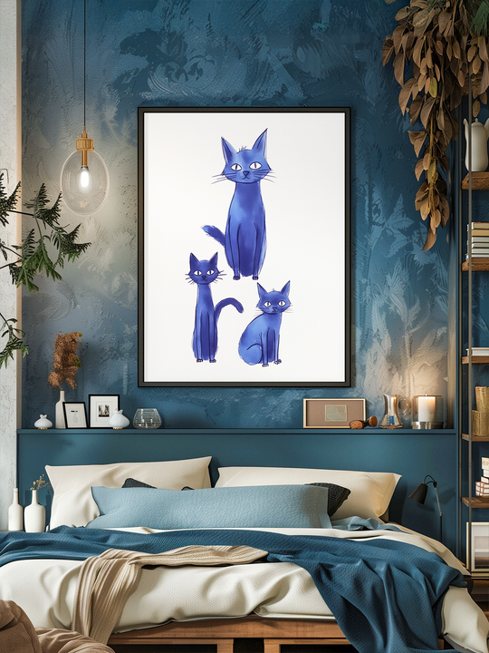 Stylish bedroom interior featuring a large framed poster of three whimsical blue cats on a white background, centered above a bed with cream and blue bedding. The wall behind the bed is painted in textured shades of teal, accented with hanging plants, shelves with books and decor, and warm lighting that creates a cozy, inviting atmosphere.