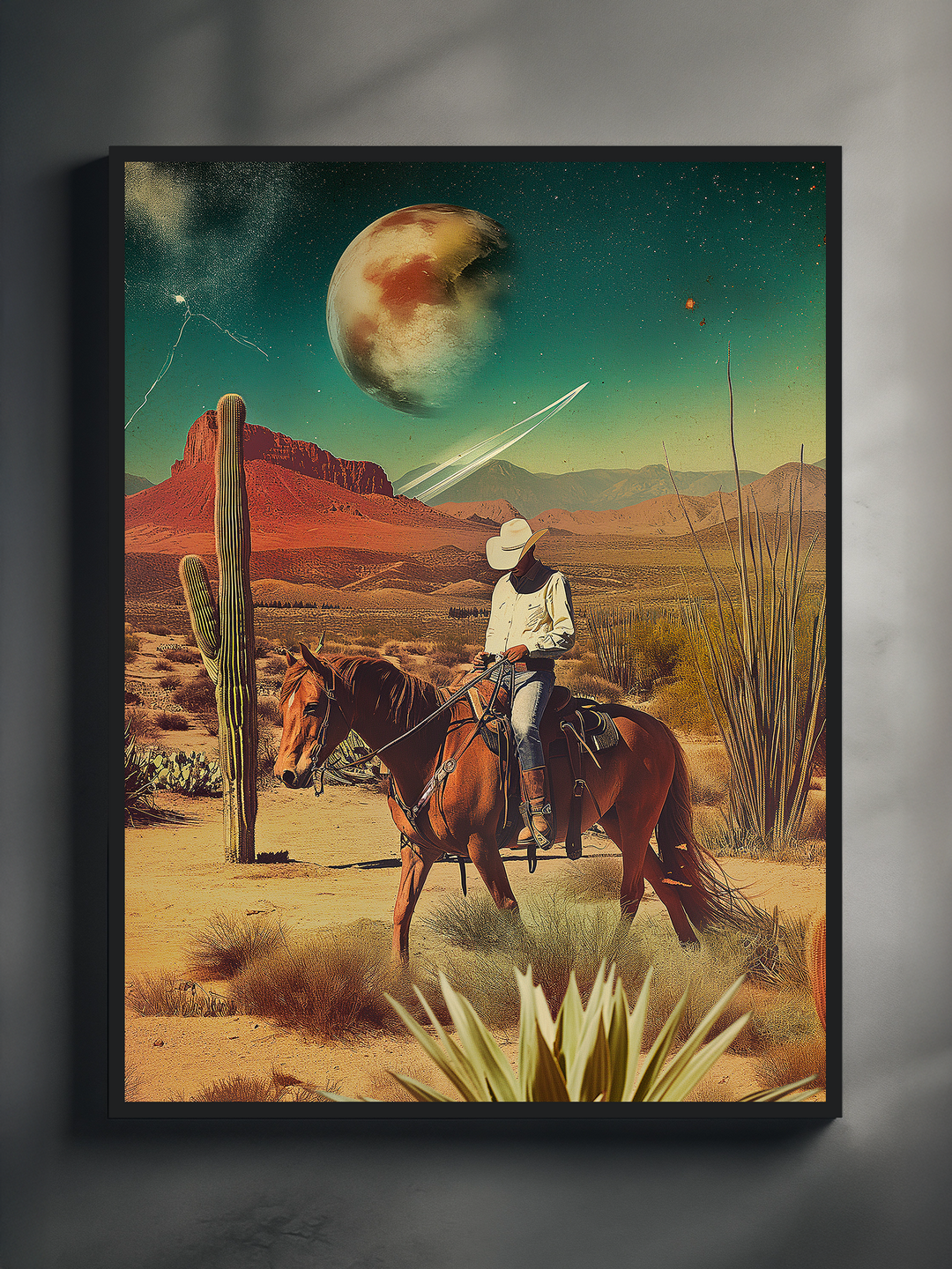 Framed art print showing a cowboy on horseback in a dry desert surrounded by cacti and agave plants, with a surreal, glowing planet and stars in the green night sky, blending Western themes with sci-fi fantasy aesthetics.