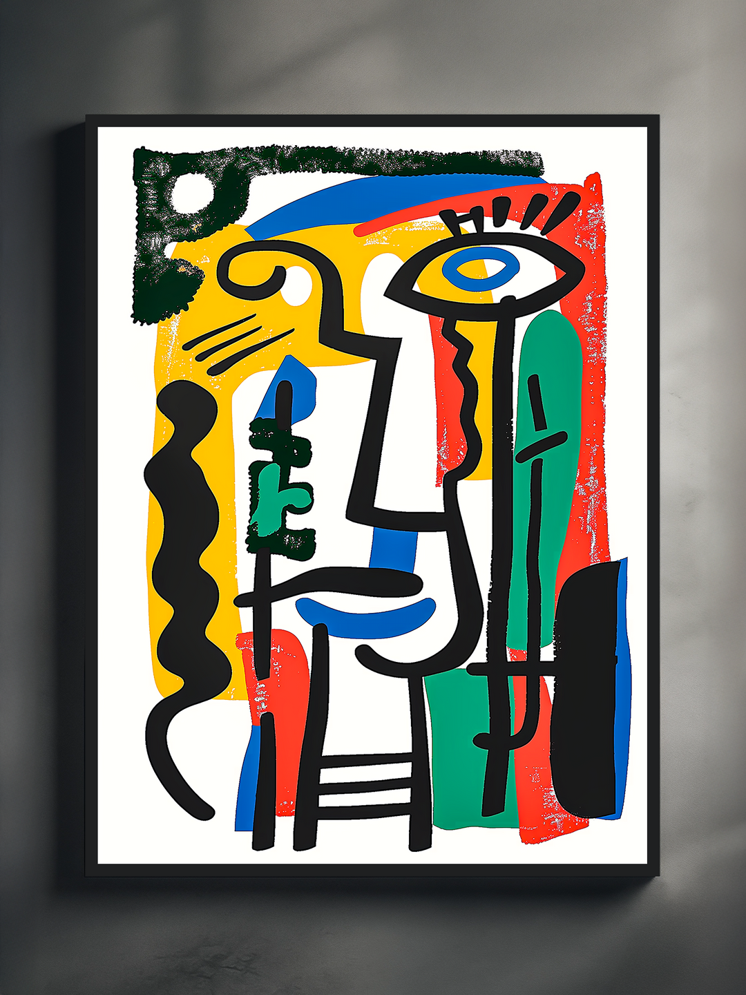Modern framed cubist abstract poster featuring black expressive lines, vibrant blocks of red, green, yellow, and blue, captured in bright natural light on a textured wall.