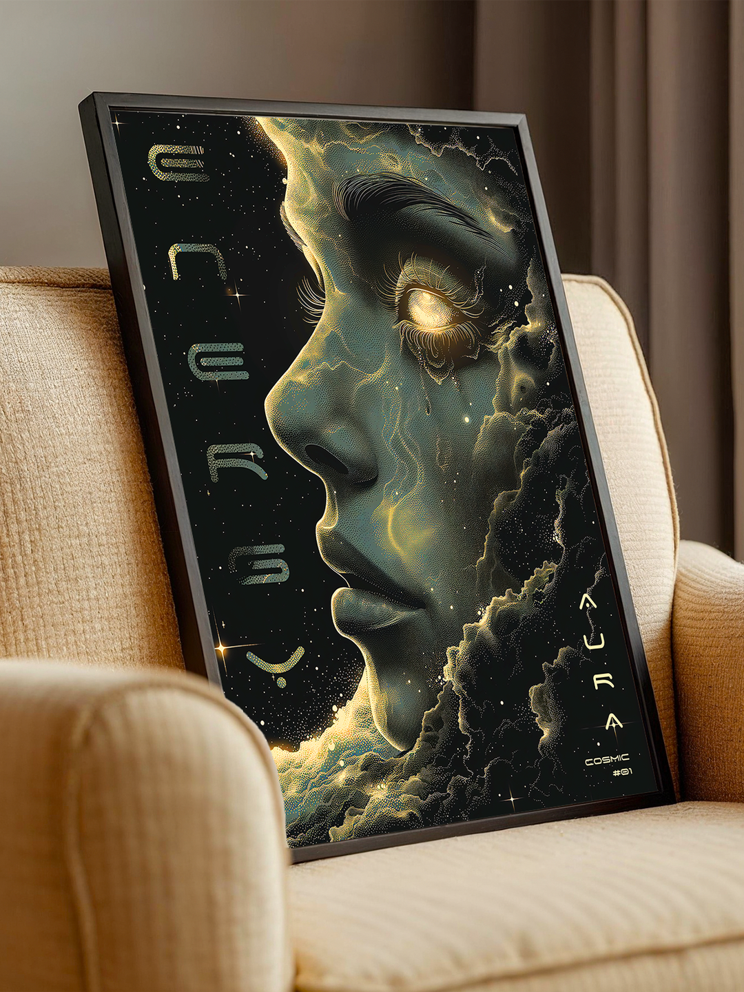 Futuristic artwork of a cosmic female face glowing with energy, placed in a sleek black frame and leaned against a beige armchair. The soft lighting and fabric texture create a cozy, modern setting that highlights the contrast between the surreal design and a relaxed home atmosphere.