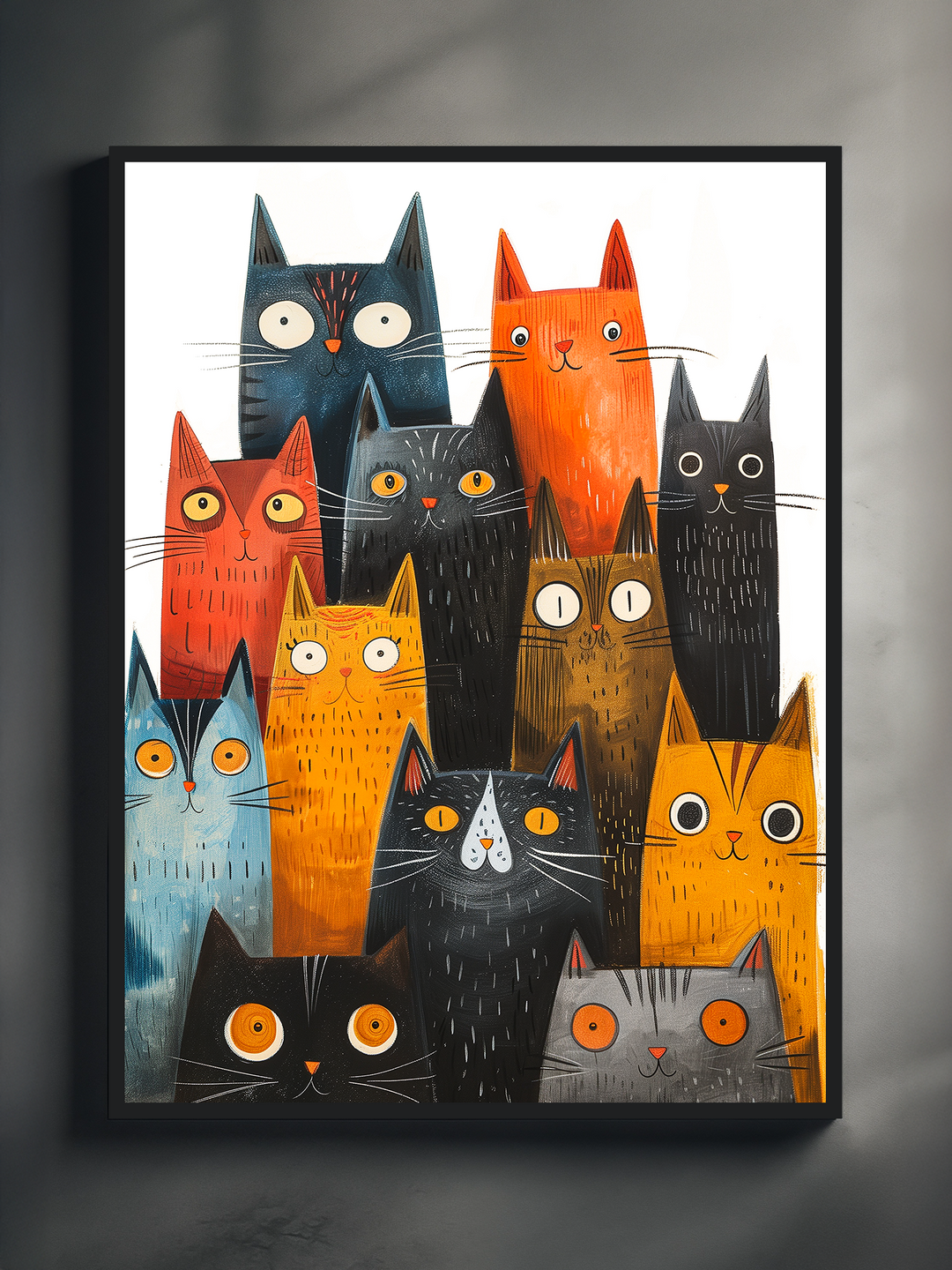 A framed art print of colorful illustrated cats with playful expressions, displayed on a grey wall with soft shadows creating a moody, gallery-like atmosphere. The frame is black with a white mat, and the vivid colors of the cats contrast strikingly against the minimal, modern background.