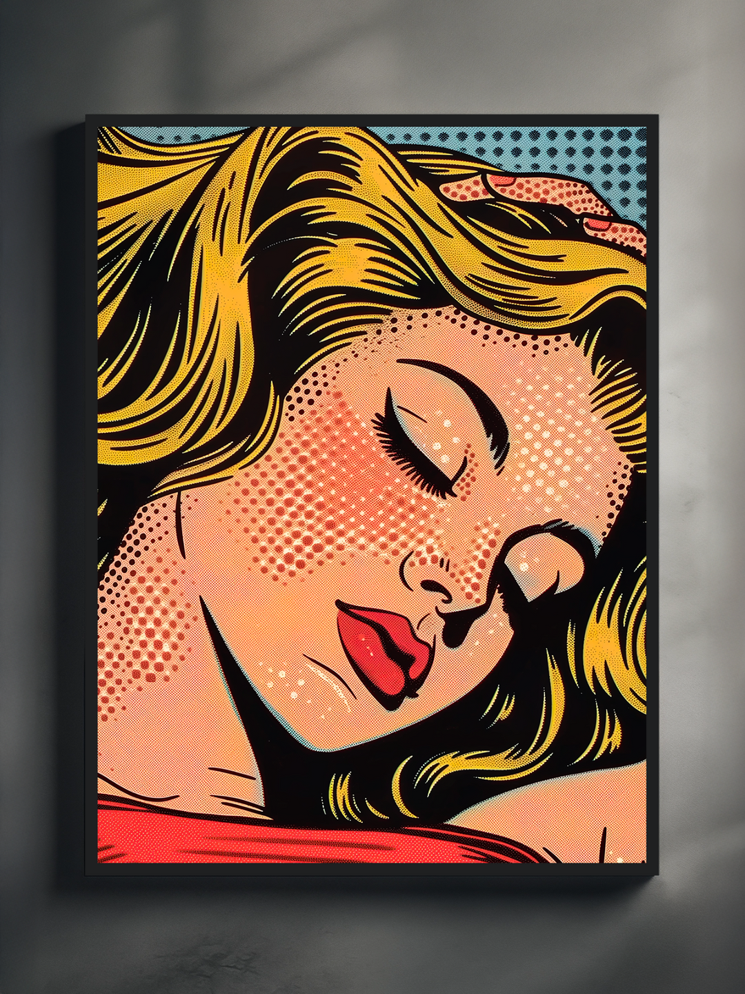 A vibrant pop art-style poster showing a blonde woman with closed eyes and red lips, printed in bold comic-style lines and framed in black, hanging on a minimalist gray wall with soft lighting.