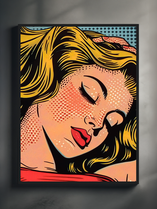 A vibrant pop art-style poster showing a blonde woman with closed eyes and red lips, printed in bold comic-style lines and framed in black, hanging on a minimalist gray wall with soft lighting.