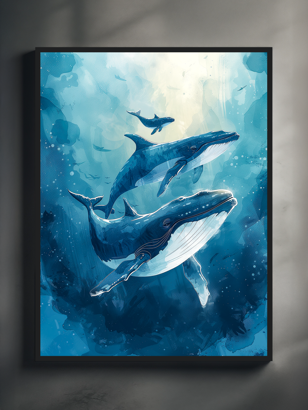 Ocean-themed blue whale illustration in a black frame, mounted on a textured grey wall with dramatic light and shadow effects, creating a bold and modern gallery-style display.