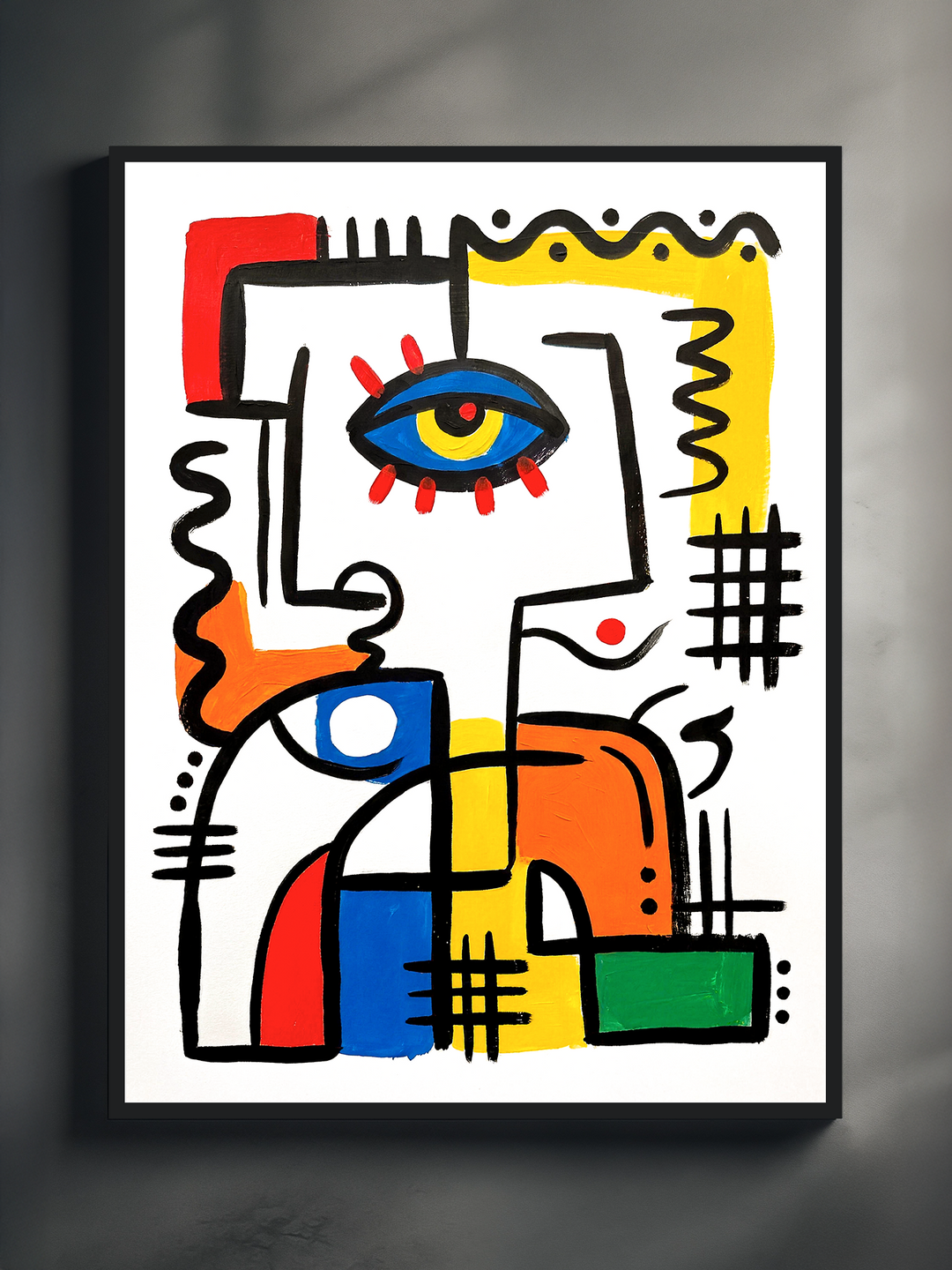 The Watcher abstract face poster with a large blue eye, framed in a black metal frame on a dark grey wall, bold red, yellow, blue, orange and green brushstroke shapes on white