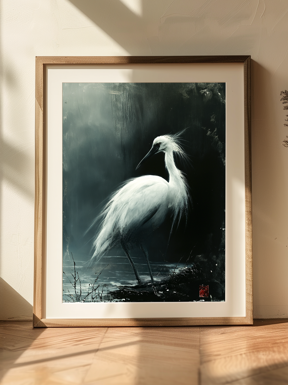 A framed art print of a white crane in traditional Japanese ink painting style, leaning against a softly lit wall. Natural sunlight casts warm shadows across the wooden floor, creating a peaceful and minimal atmosphere that highlights the elegance of the artwork.