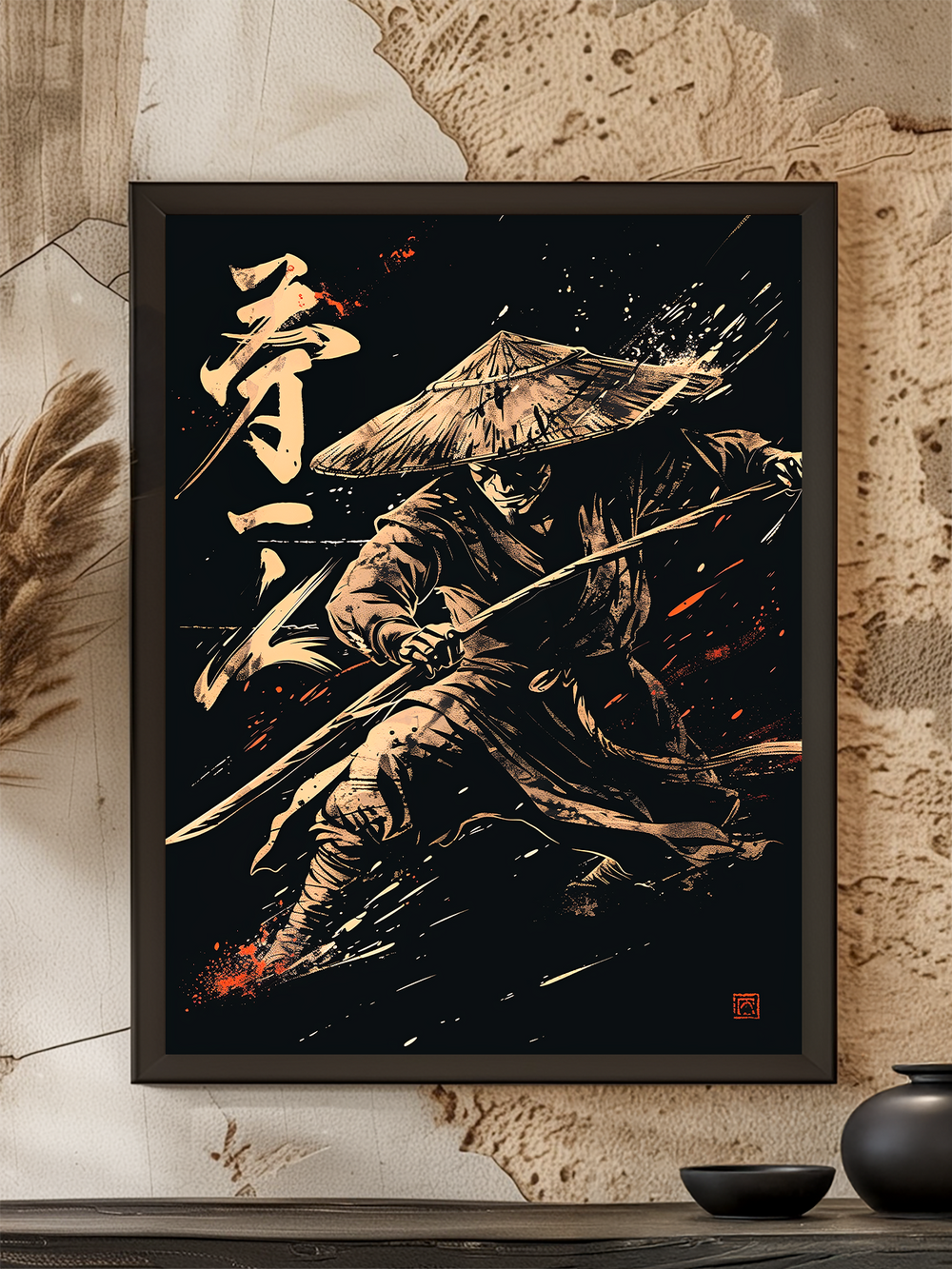 A dramatic samurai artwork in a black frame, mounted on a textured wall with Japanese-inspired decor. The intense ink-style design features a warrior with a straw hat and katana in mid-strike, with splashes of red and white adding dynamic energy. A ceramic vase and bowl complete the minimalist display.