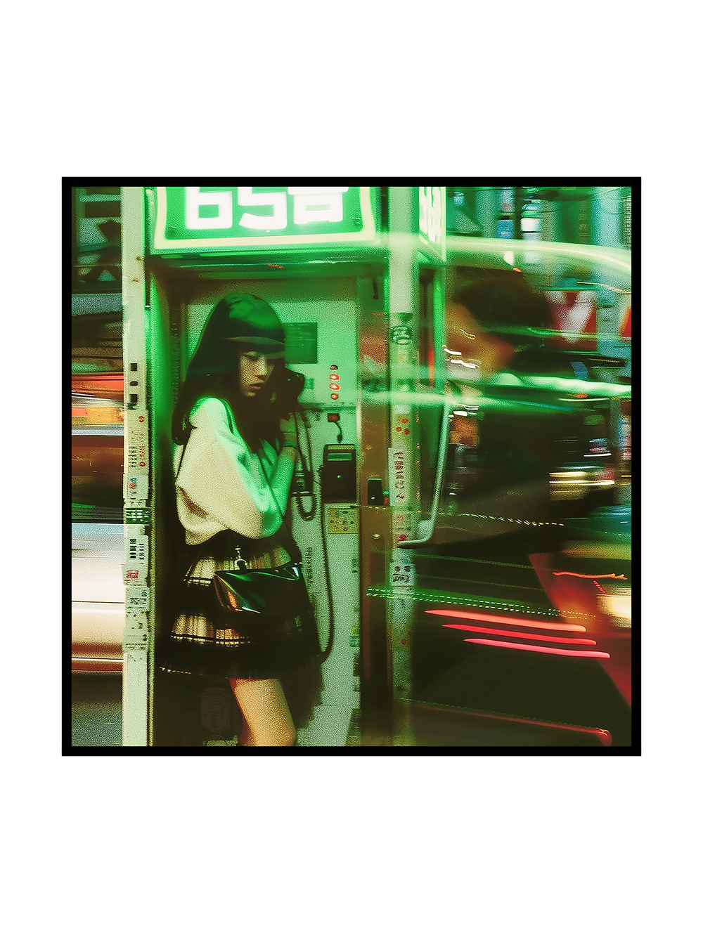 A cinematic street photography scene showing a woman standing inside a phone booth in an Asian metropolis. Surrounded by motion-blurred traffic and glowing city lights, she remains calm and focused during her call, capturing a quiet moment of stillness within the fast-moving intensity of urban life.