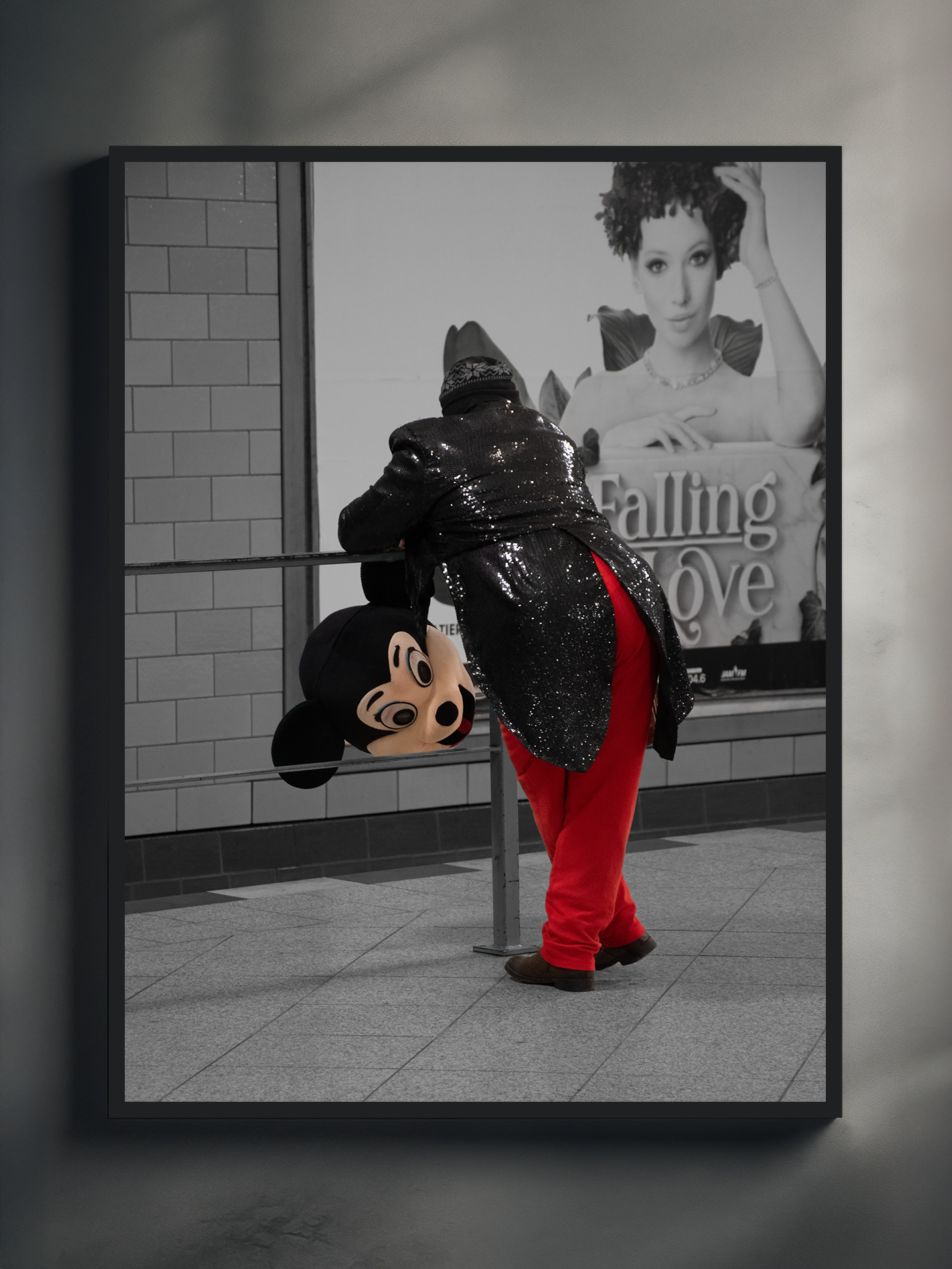 urban wall art featuring a costumed mouse mascot leaning forward at a subway station, with bold red pants and a gritty city background, modern street photo print.